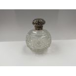 A Circa 1900 silver topped crystal glass globe scent bottle