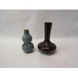 A Chinese ceramic bombe vase and another similar. 13cm and 10cm (2)