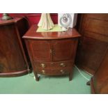 A George III flame mahogany bow front nightstand with satinwood line inlay, the two door cupboard