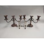 A pair of plated three sconce candlesticks and a pair of epergne holders