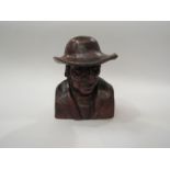 A 19th Century Swiss carved wooden bust of an old gent, 18cm high