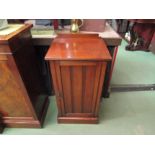 A late Victorian Maple of London walnut bedside cupboard the single door over a plinth base, 79cm