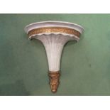 A modern composite gilt and white painted wall bracket. 36cm length