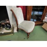 A circa 1860 rosewood slipper chair with carved acanthus leaf decoration on scroll feet and