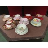 Eight cups and saucers with internal floral decoration- Aynsley, Royal Chelsea, etc. (Paragon