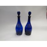 A pair of Royal commemorative cascade Bristol blue decanters
