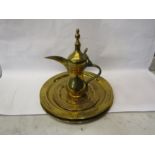 A Turkish brass coffee pot, a plate and two chargers (4)