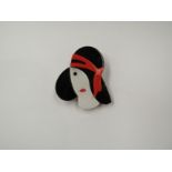 A Lea Stein style brooch of an Art Deco lady with black hat
