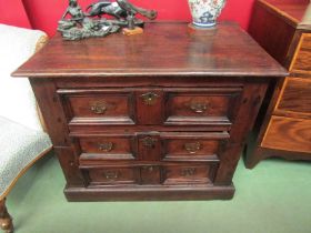 Circa 1700 an oak two section country cottage chest of three drawers the planked top and panelled