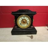 A late 19th/early 20th Century black Belgian marble mantel clock with lion mask detail