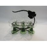 A set of six green stem wine goblets with grape and vine etched design together with a metal