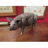 A bronzed/gilt effect figure of a pig, 25cm long, 13.5cm tall