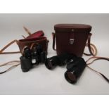 A pair of cased Carl Zeiss Jena Jenoptem 10x50W binoculars and a cased pair of Coe (Norwich) 8x30