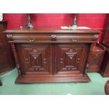 A 19th Century French oak buffet sideboard the two frieze drawers over a two door cupboard with
