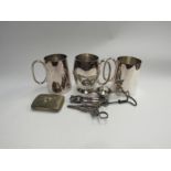 Three plated tankards, grape scissors and nut crackers