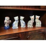 Five Oriental ceramic figures, an owl and two pairs of cats