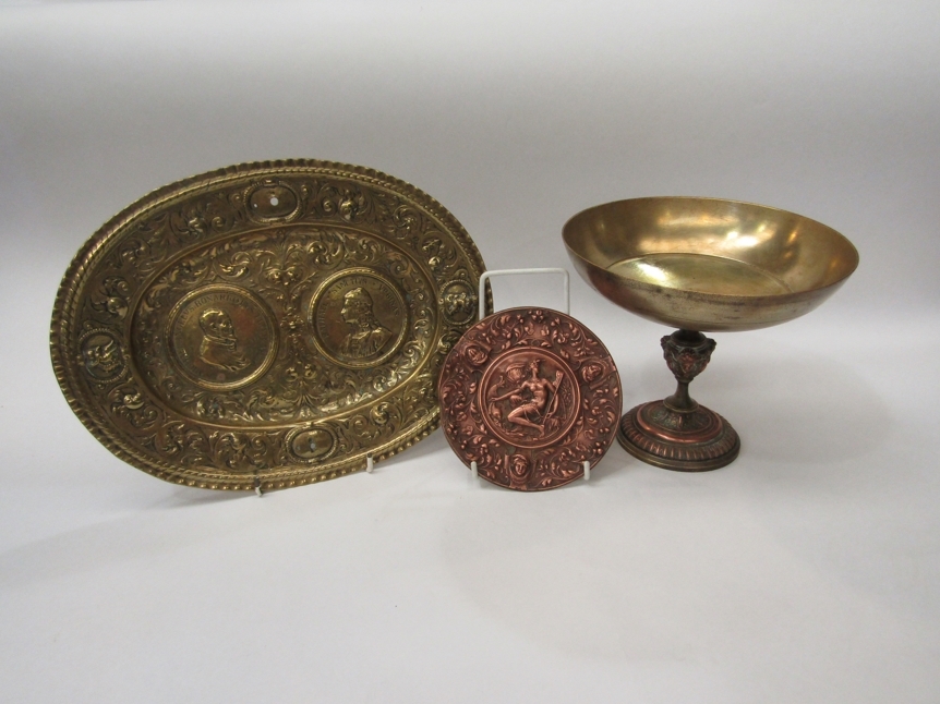 Three items possibly from a grand tour, an Italian brass plaque, 29cm wide, a French brass tazza and