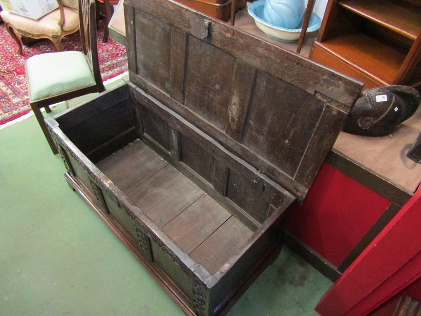 A 17th Century and later oak three panel coffer the split hinged rising top over a carved front on - Image 4 of 4