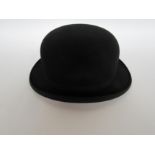 A black bowler hat, Jones & Dunn hatters of Kings Lynn label to interior