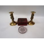 A pair of brass candlesticks with figural seated imps, a cinnabar style box decorated with birds