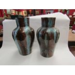 A pair of turquoise and brown glazed bulbous vases with numbered bases, one a/f, 36cm tall