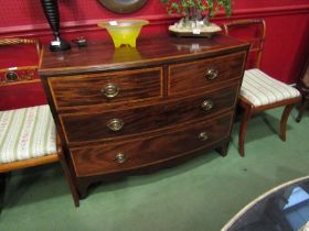 A 19th Century crossbanded flame mahogany bow front chest of two short over two long drawers on