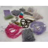 A quantity of bracelets and necklaces, including tigers eye, amethyst and kunzite