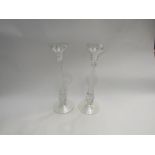 A pair of pearlescent glass candlesticks, 29cm tall