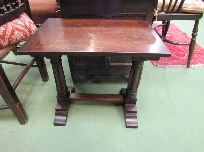 A circa 1920 oak occasional table, the rectangular shaped top over turned and recessed legs on