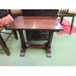 A circa 1920 oak occasional table, the rectangular shaped top over turned and recessed legs on