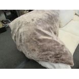 A large mushroom coloured faux fur throw