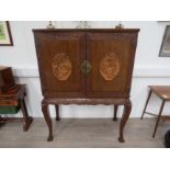 A 20th Century Chinese hardwood cabinet on stand, geometric and foliate carved frame, figural