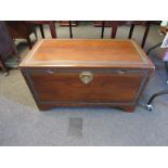 A 20th Century Oriental camphor blanket box containing original paperwork, lock and fans. 52cm x