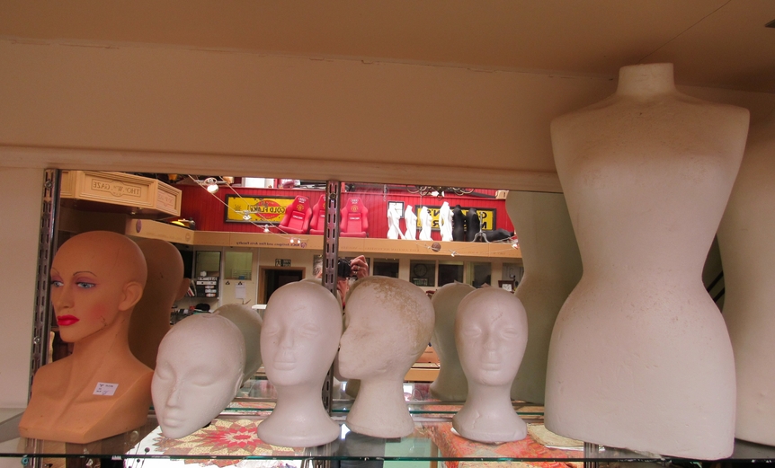 Two female tailors dummies, two wooden bases, a male torso tailors dummy, five mannequins heads