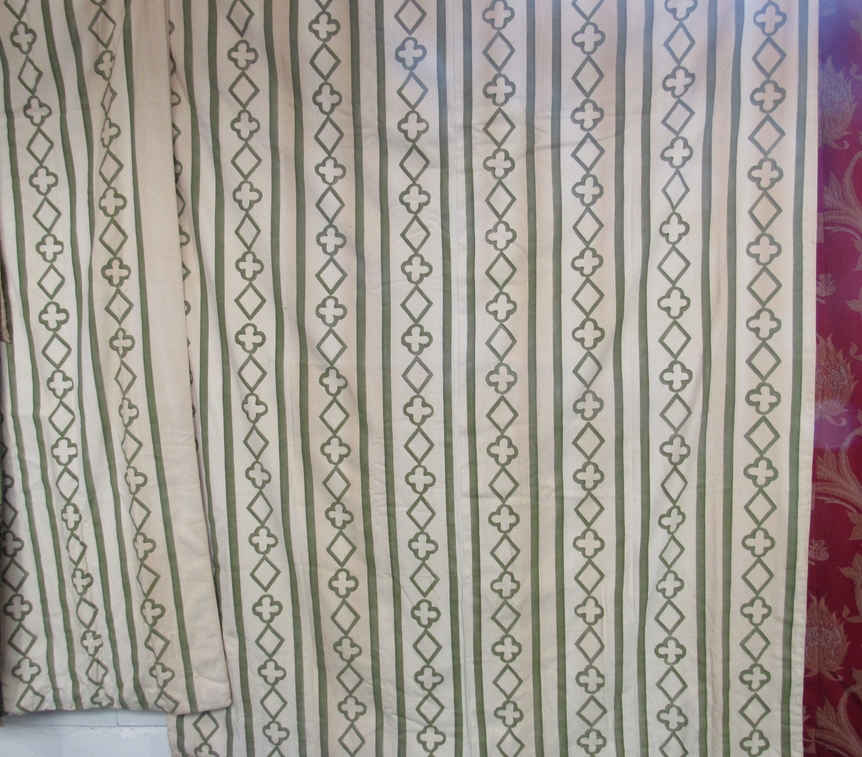 A pair of cream ground curtains, green Gothic influence pattern, 210cm drop x 160cm width and