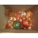 A box containing a quantity of carnival glass including cups, bowls, vases and candlesticks etc.