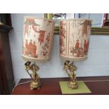 A pair of gilded figural table lamps of Oriental men in coolie hats