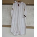 A Bulgarian cream cotton tunic with hand stitched embroidered collar and cuffs together with a