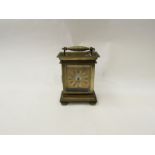 A small early 19th Century carriage clock, ca. 1825, brass case, silvered dial with central
