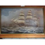 A 19th Century oil painting of a ship on panel surrounded by maple frame, 26cm x 43cm