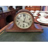 A German 1930's chiming mantel clock, 'hump-back' veneered case. 8-day pendulum movement with