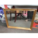 A rectangular gilt framed wall mirror with bevel edge, 51cm x 67cm