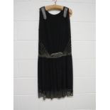 A black crepe 20's evening dress, daisy beaded design in white and silver