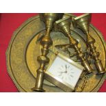 An ornate brass charger, candlesticks, mantel clock and sundial etc.