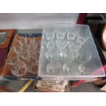 Two boxes containing assorted sets of glasses including sherry glasses, sundae dishes etc.