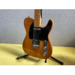 A Harley Benton VT Series telecaster style electric guitar with natural body, black pickguard,