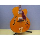 A Fenix hollowbody semi-acoustic guitar, yellow natural body, tortoiseshell effect pickguard, gilded