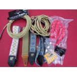 A quantity of guitar accessories including straps, cables and jacks etc