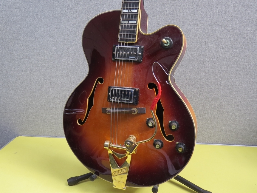 A Yamaha AE2000 Japanese-made archtop semi-acoustic guitar, sunburst body, replacement pickups and