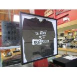 A 'No Music On A Dead Planet' T shirt designed by Jamie Reid for Music Declares Emergency, framed